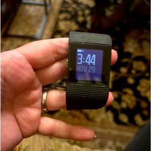 Fitbit watch comes with charger.